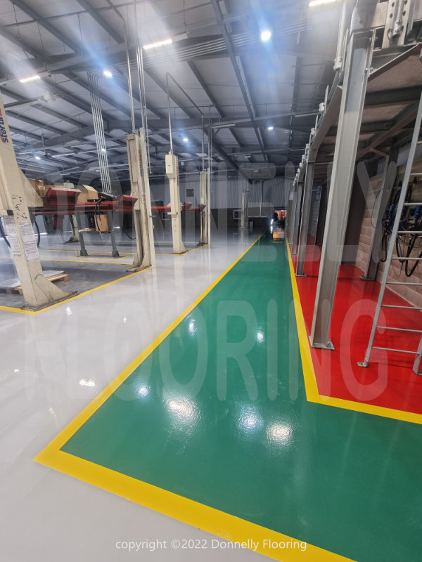 epoxy resin flooring - application of top layer and colours